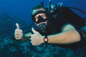 Scuba diver giving thumbs up underwater